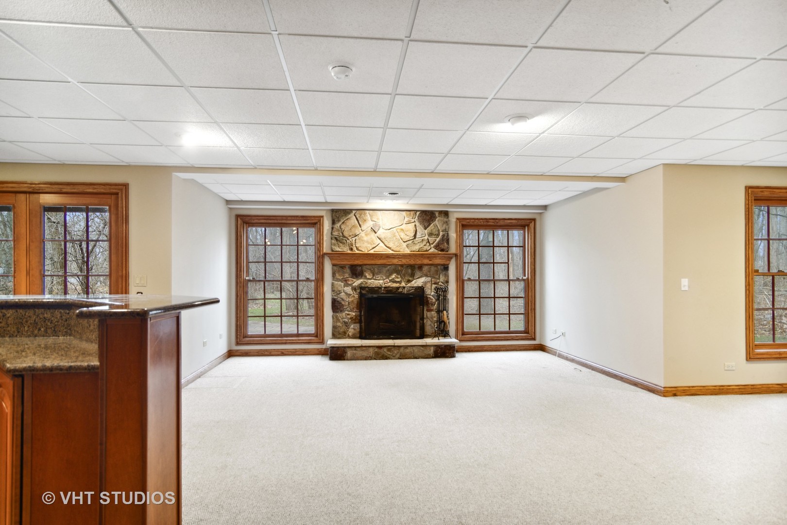 902 Bridle Lane Cary, IL 60013 - Photo 36 of 60 a view of an empty room with a fireplace and a window