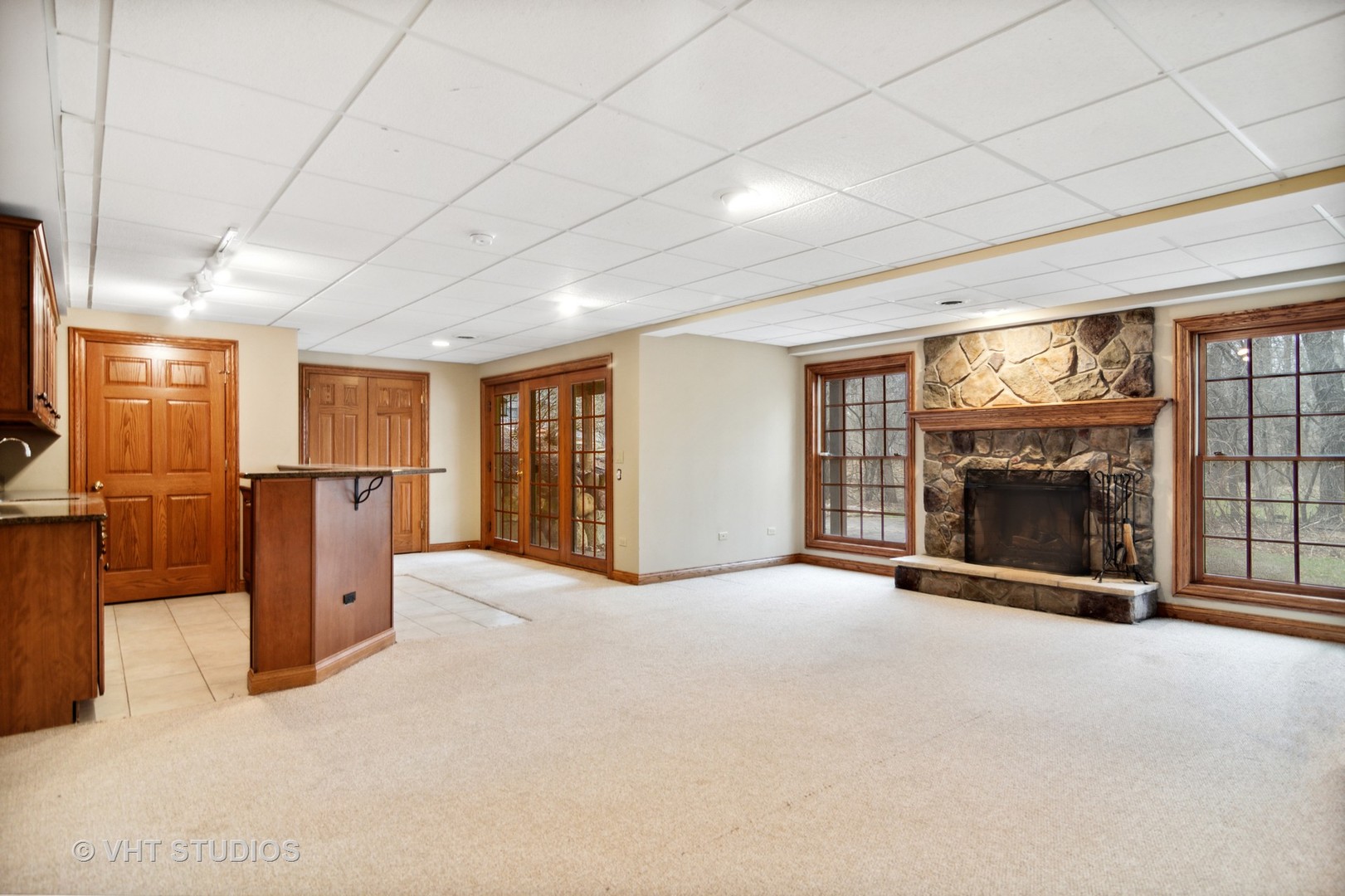 902 Bridle Lane Cary, IL 60013 - Photo 39 of 60 a view of an empty room with a fireplace and a window