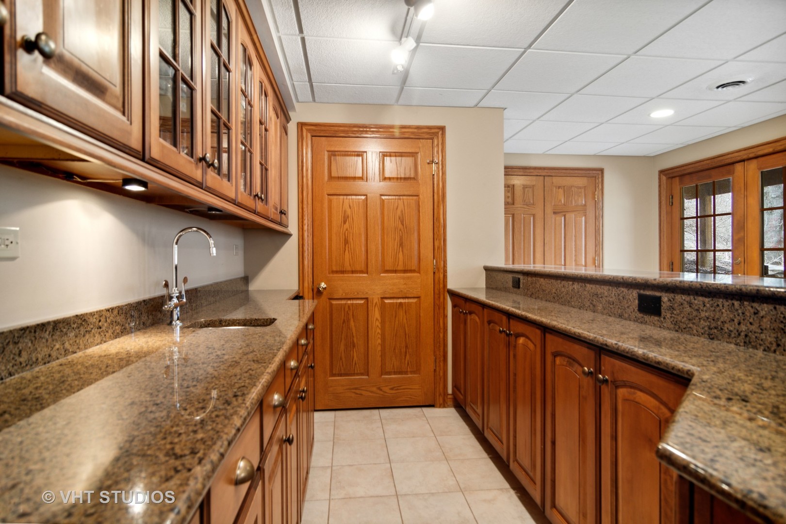 902 Bridle Lane Cary, IL 60013 - Photo 43 of 60 a kitchen with granite countertop a sink and stove
