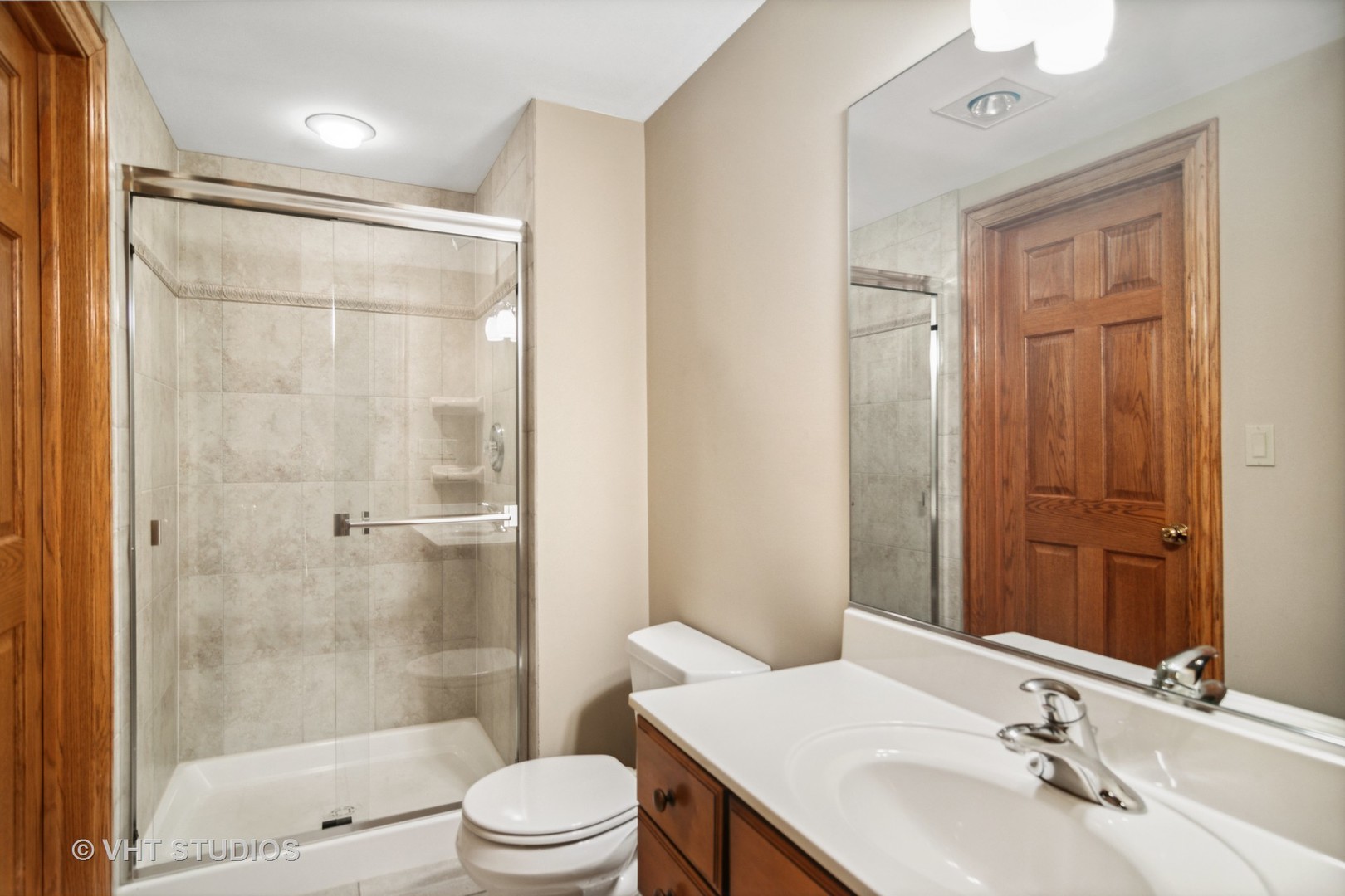 902 Bridle Lane Cary, IL 60013 - Photo 45 of 60 a bathroom with a sink a toilet and shower