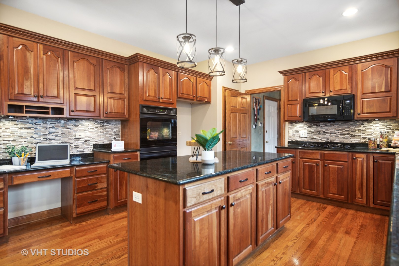 902 Bridle Lane Cary, IL 60013 - Photo 5 of 60 a kitchen with stainless steel appliances granite countertop a stove a sink dishwasher and a refrigerator with wooden floor