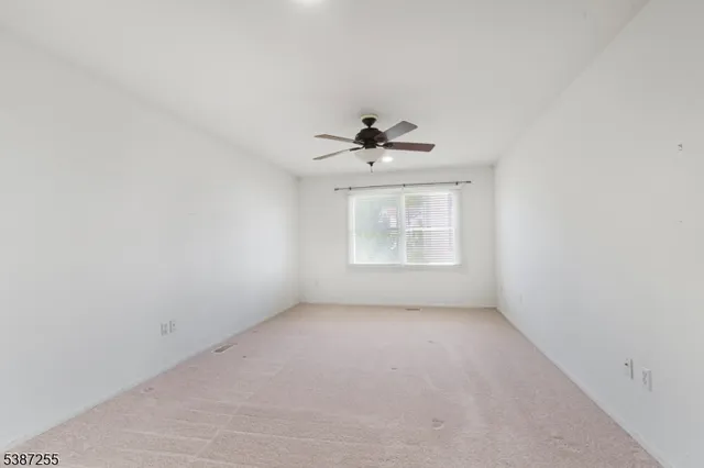 an empty room with a empty space and a window