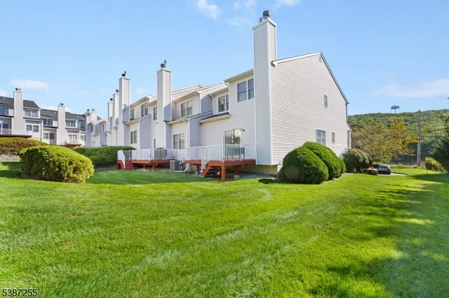 a view of a garden with a house