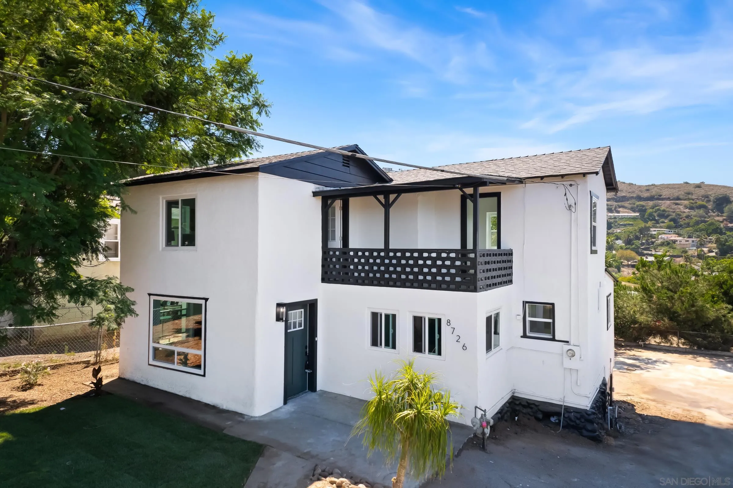a house view with a garden space