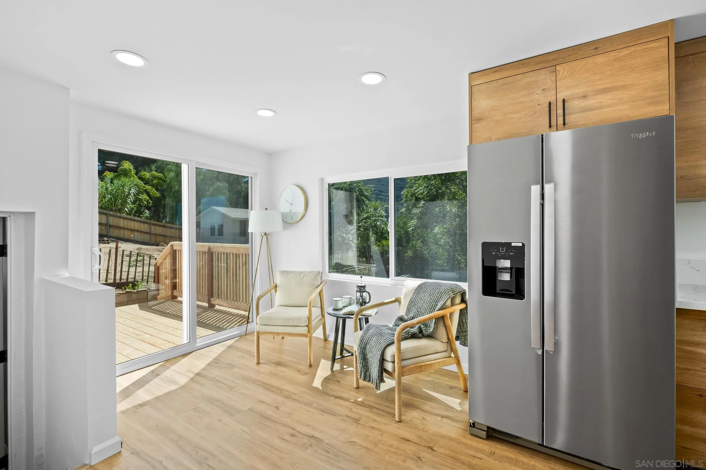 8726 Almond Road Lakeside, CA 92040 - Photo 13 of 31 a view of a dining room with furniture a chandelier and wooden floor