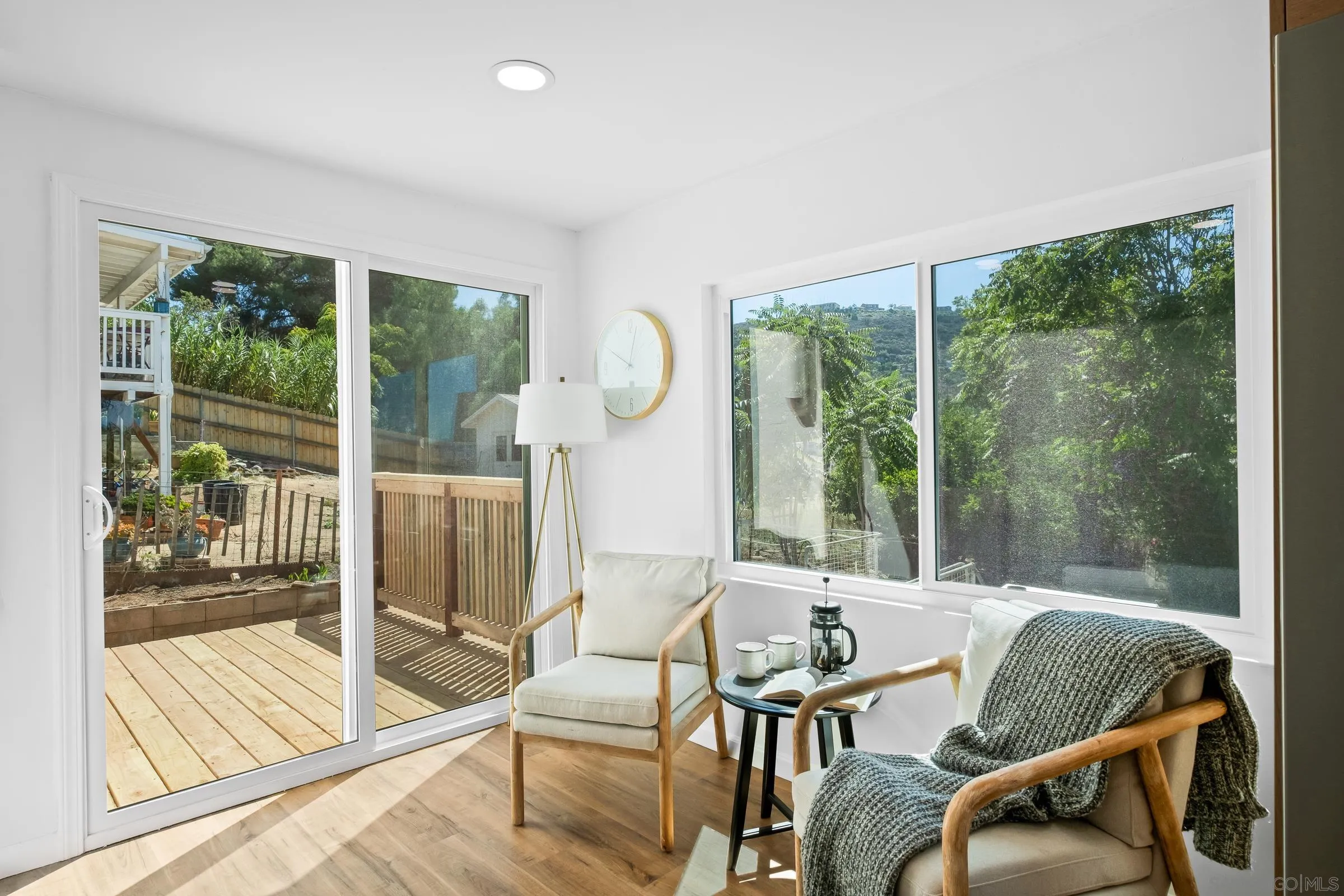 8726 Almond Road Lakeside, CA 92040 - Photo 14 of 31 a living room with furniture and a floor to ceiling window