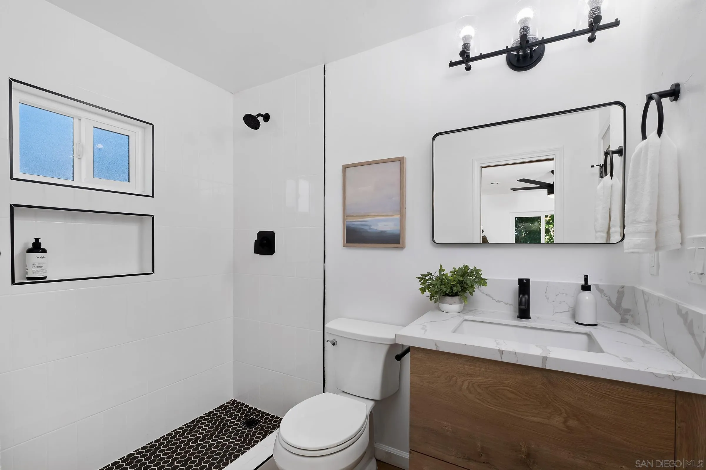 8726 Almond Road Lakeside, CA 92040 - Photo 22 of 31 a bathroom with a sink vanity granite toilet and a mirror