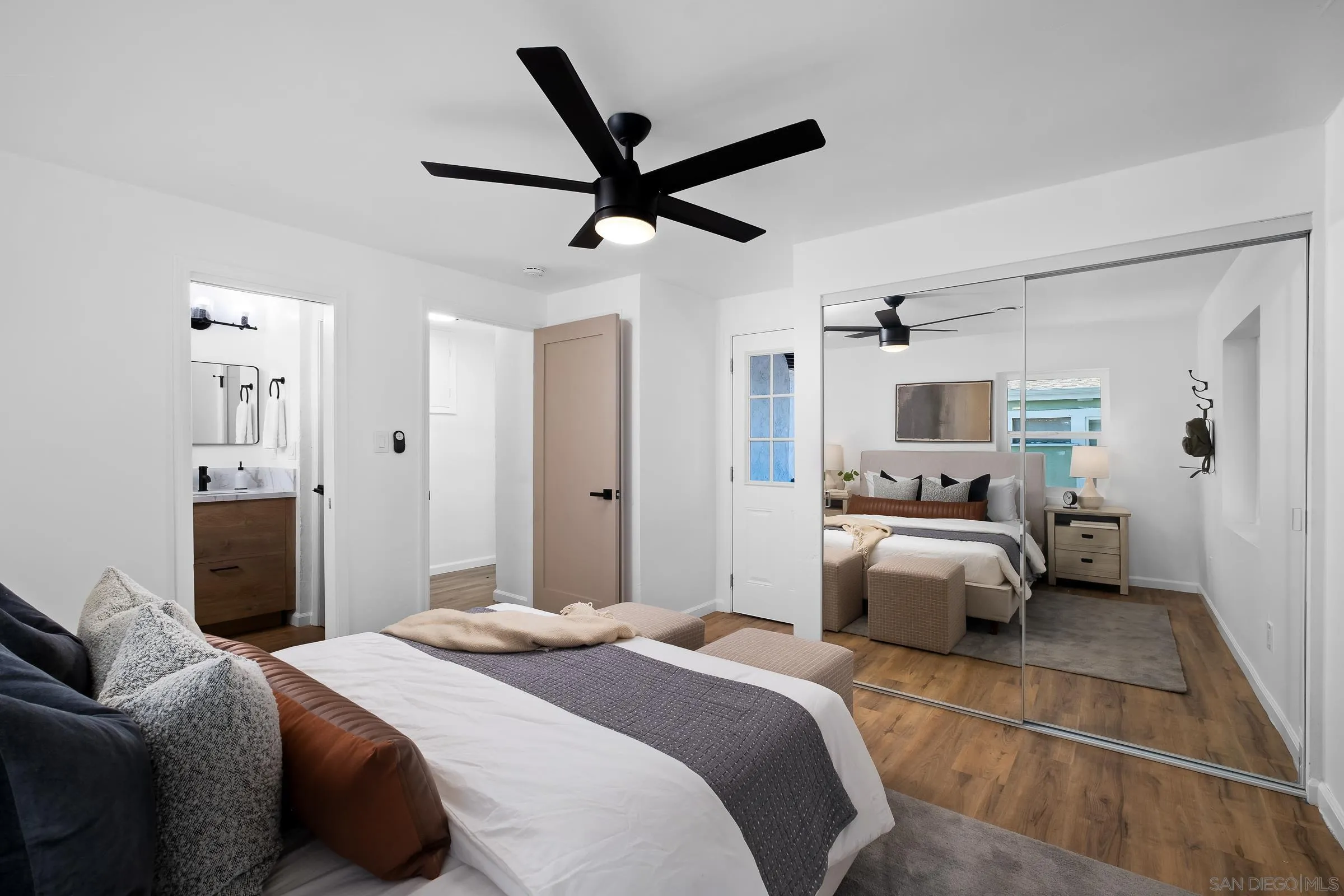 8726 Almond Road Lakeside, CA 92040 - Photo 23 of 31 a bedroom with a bed and ceiling fan