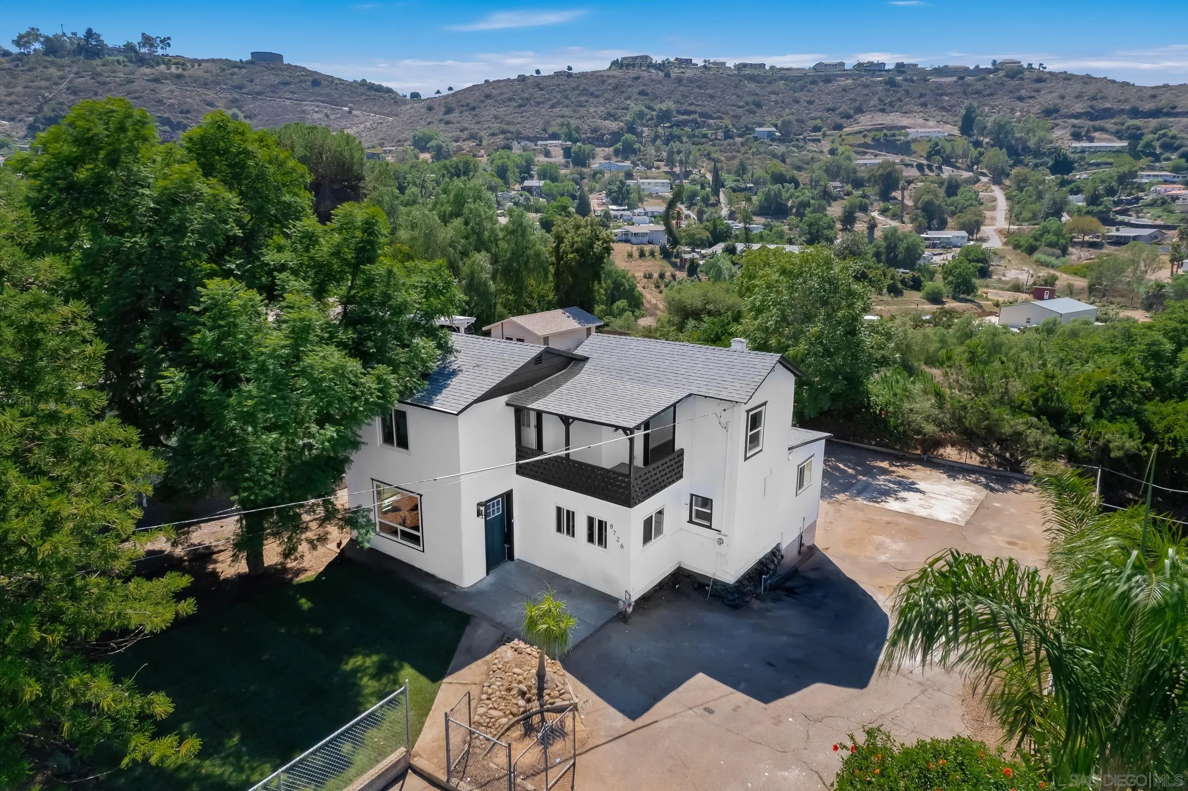 8726 Almond Road Lakeside, CA 92040 - Photo 25 of 31 an aerial view of a house with a yard