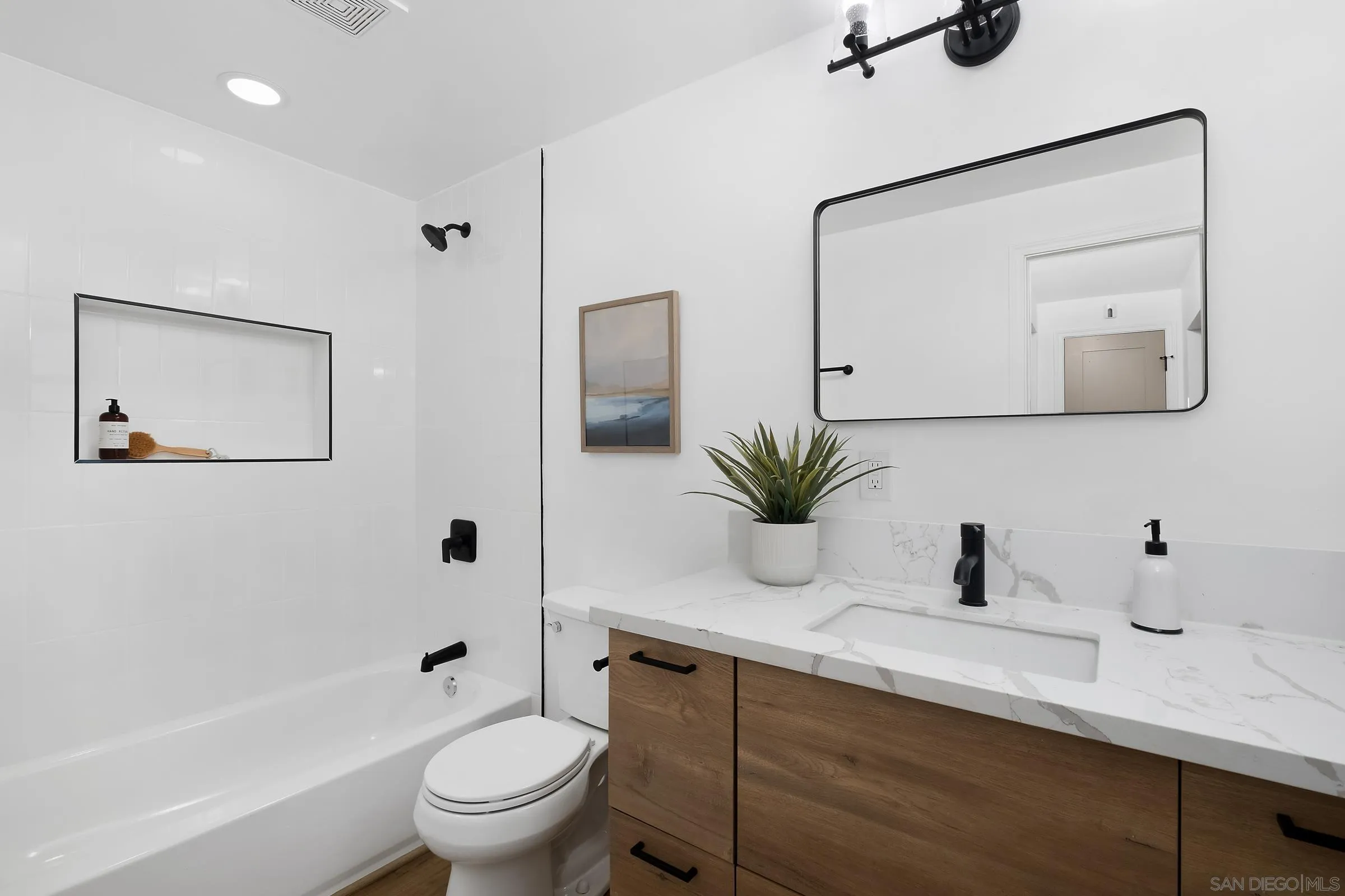 8726 Almond Road Lakeside, CA 92040 - Photo 10 of 31 a bathroom with a granite countertop sink a toilet and mirror
