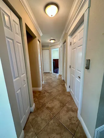 a bedroom with a bed and a flat tv screen