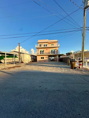 a view of a car is parked in front of a house