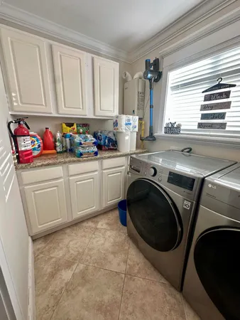 a spacious bathroom with a toilet sink and mirror
