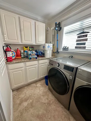 a spacious bathroom with a toilet sink and mirror