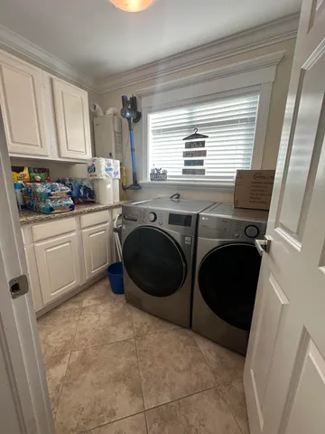 a spacious bathroom with a toilet sink and mirror