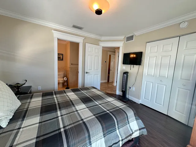 a view of livingroom with hardwood floor and workspace