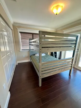 a bathroom with a glass door shower sink and mirror