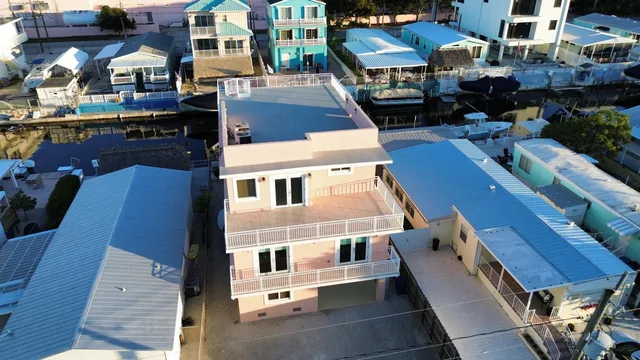 a view of multiple houses with a street