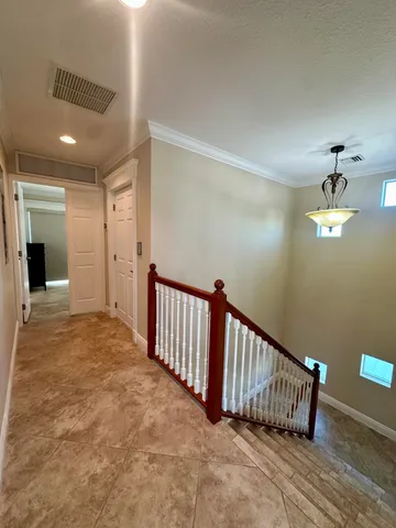 a living room with a bed furniture and a wooden floor