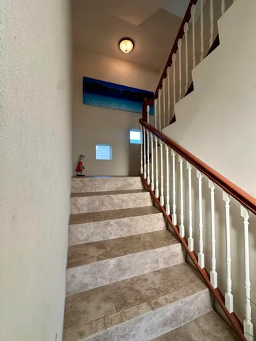 a large kitchen with a large counter top appliances and cabinets