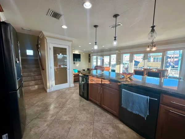 a kitchen with stainless steel appliances granite countertop a stove and a sink