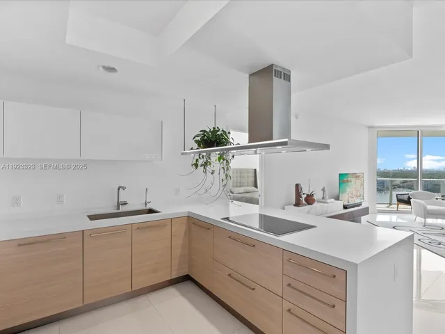 a kitchen with a sink cabinets and window