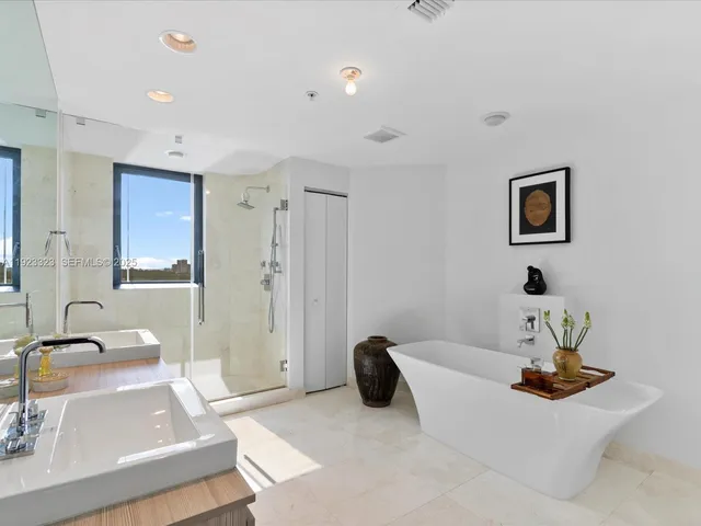 a living room with furniture and a sink