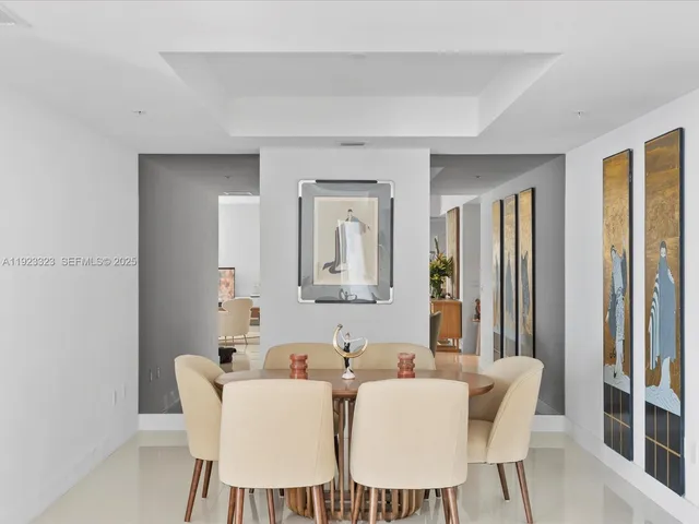 a view of a dining room with furniture and a window