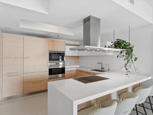 a kitchen with a refrigerator and a sink