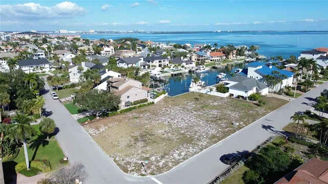 an aerial view of a residential houses with outdoor space