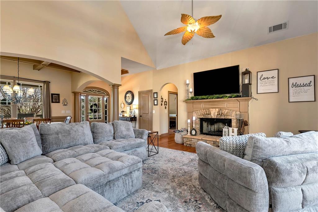 321 Chumbley Road Dawsonville, GA 30534 - Photo 11 of 65 a living room with furniture a flat screen tv and a fireplace