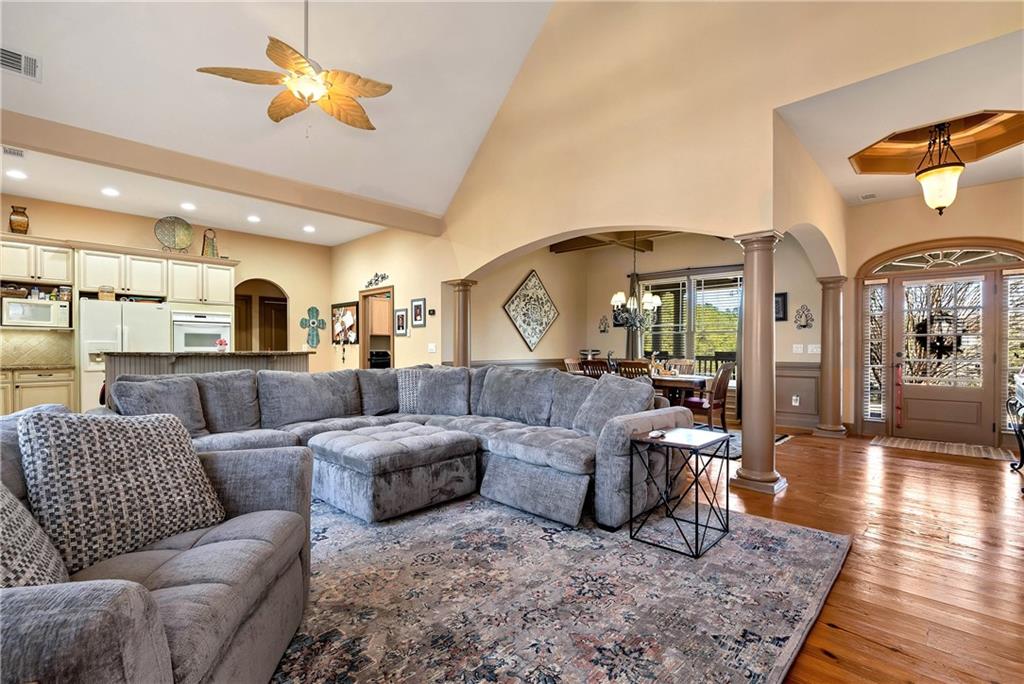 321 Chumbley Road Dawsonville, GA 30534 - Photo 12 of 65 a living room with furniture kitchen view and a wooden floor