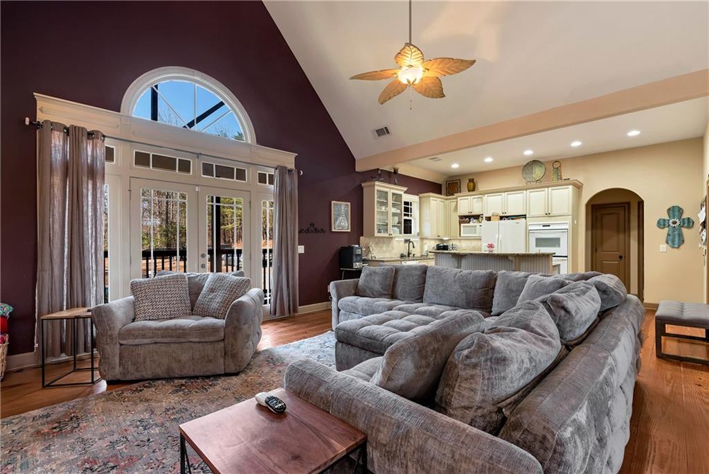 321 Chumbley Road Dawsonville, GA 30534 - Photo 13 of 65 a living room with furniture and a chandelier