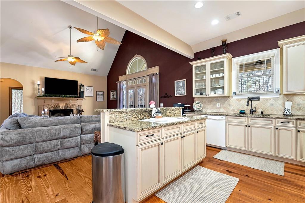 321 Chumbley Road Dawsonville, GA 30534 - Photo 19 of 65 a kitchen with a stove a sink and a microwave