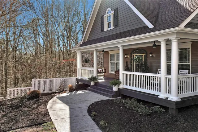 a view of a house with a bench and wooden floor