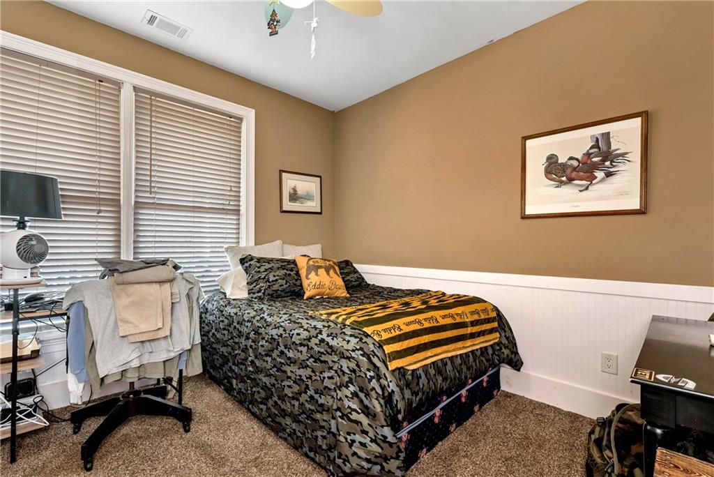 321 Chumbley Road Dawsonville, GA 30534 - Photo 29 of 65 a bedroom with bed and a window