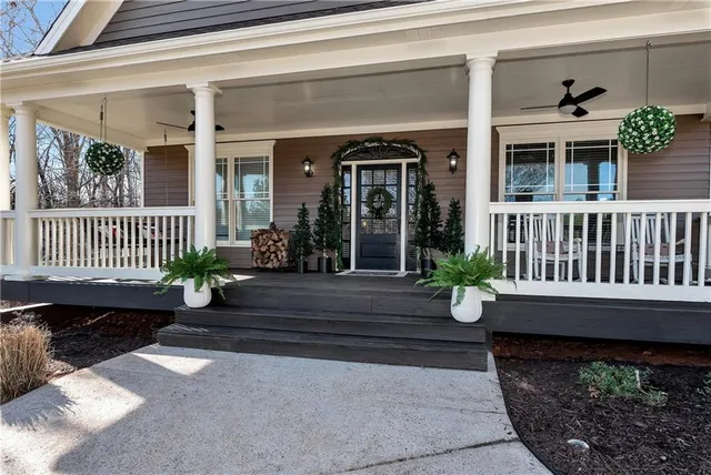 a outdoor space with lots of furniture and wooden floor