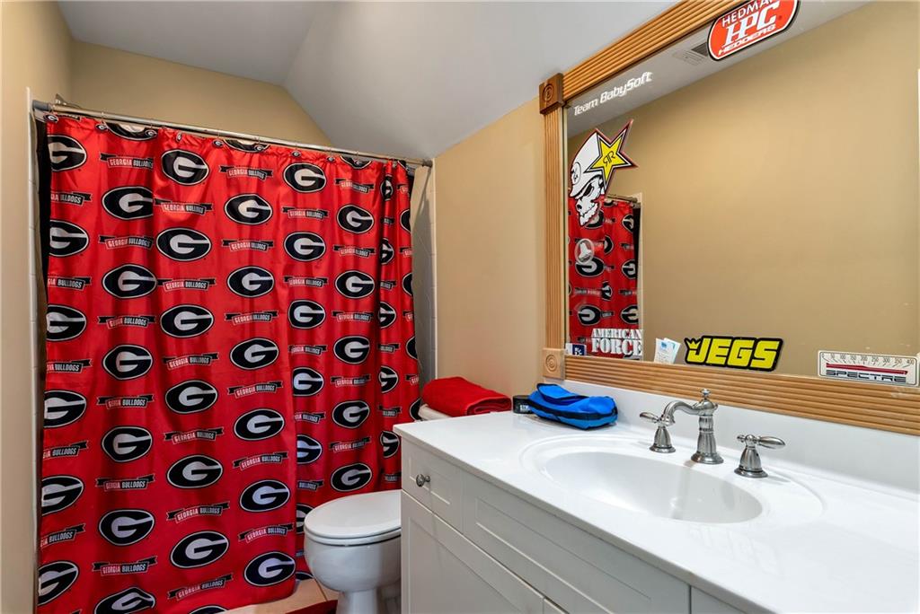 321 Chumbley Road Dawsonville, GA 30534 - Photo 34 of 65 a bathroom with a sink and a mirror