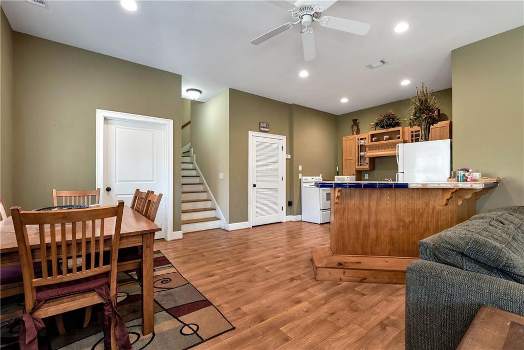 321 Chumbley Road Dawsonville, GA 30534 - Photo 40 of 65 a living room with furniture and a wooden floor