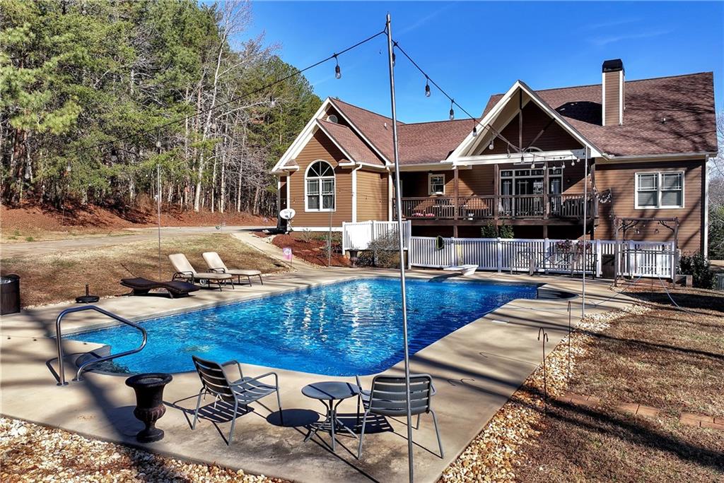 321 Chumbley Road Dawsonville, GA 30534 - Photo 43 of 65 a front view of house with yard outdoor seating and barbeque oven