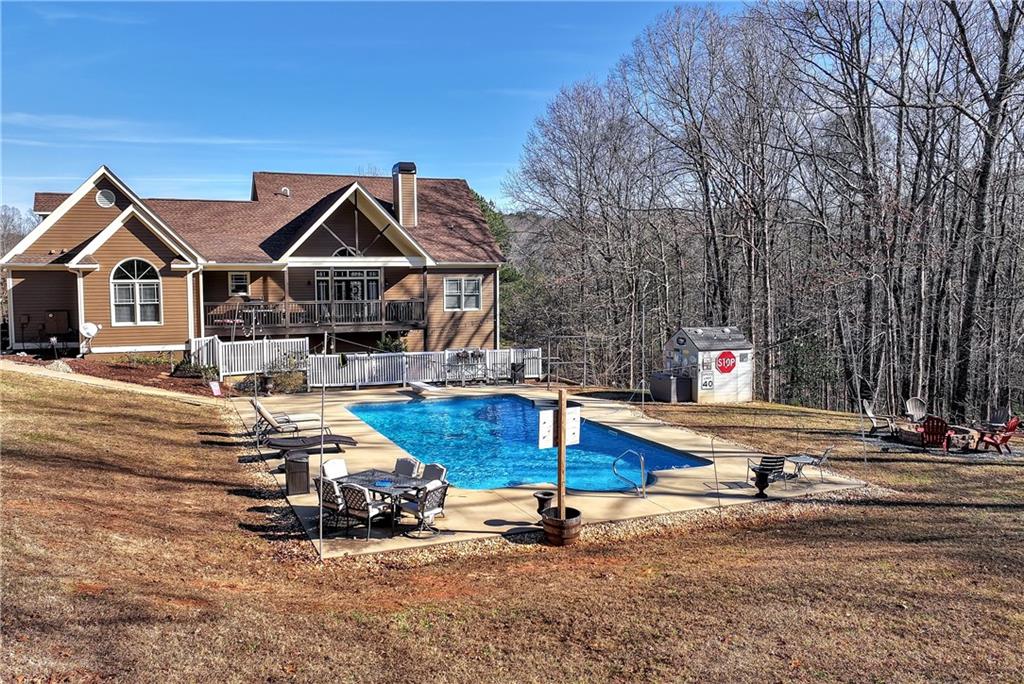 321 Chumbley Road Dawsonville, GA 30534 - Photo 44 of 65 a front view of house with yard and entertaining space