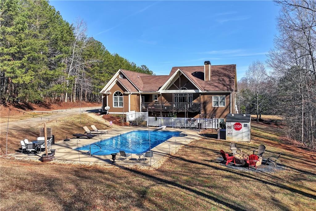 321 Chumbley Road Dawsonville, GA 30534 - Photo 48 of 65 a front view of a house with swimming pool