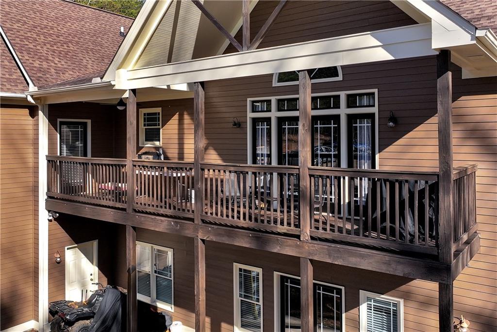 321 Chumbley Road Dawsonville, GA 30534 - Photo 50 of 65 a view of a house with roof and deck
