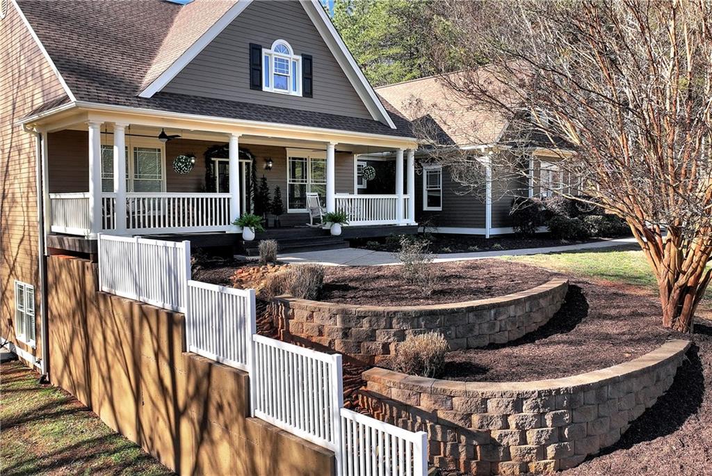 321 Chumbley Road Dawsonville, GA 30534 - Photo 52 of 65 a view of a house with backyard and sitting area