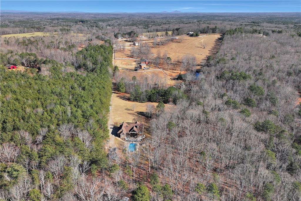 321 Chumbley Road Dawsonville, GA 30534 - Photo 62 of 65 an aerial view of a house with a yard