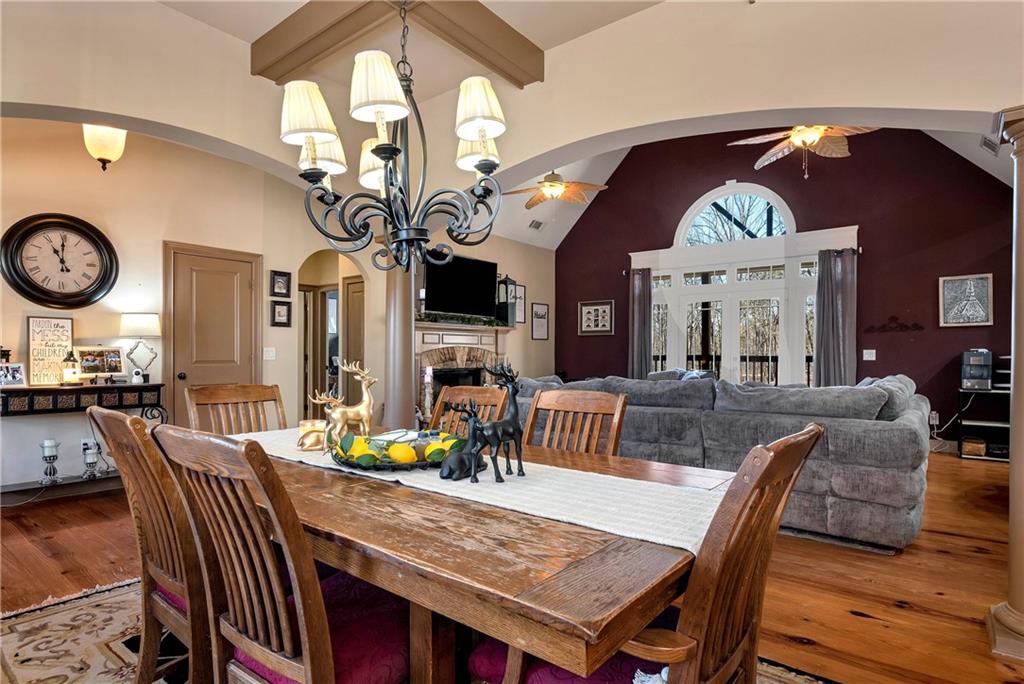 321 Chumbley Road Dawsonville, GA 30534 - Photo 8 of 65 a view of a dining room with furniture a chandelier and wooden floor