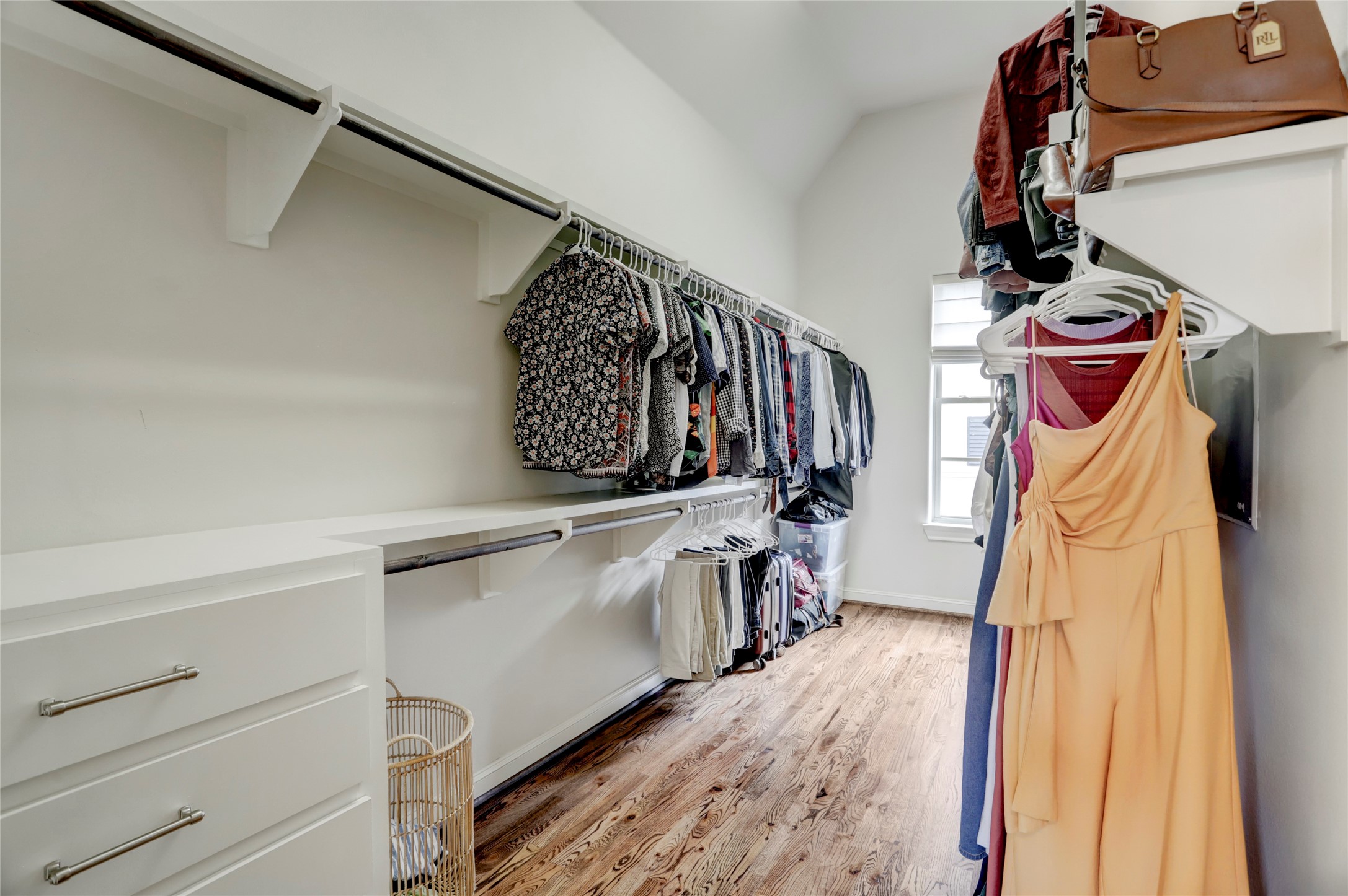 1348 West 25th Street Houston, TX 77008 - Photo 26 of 34 a view of walk in closet with clothes and shoes