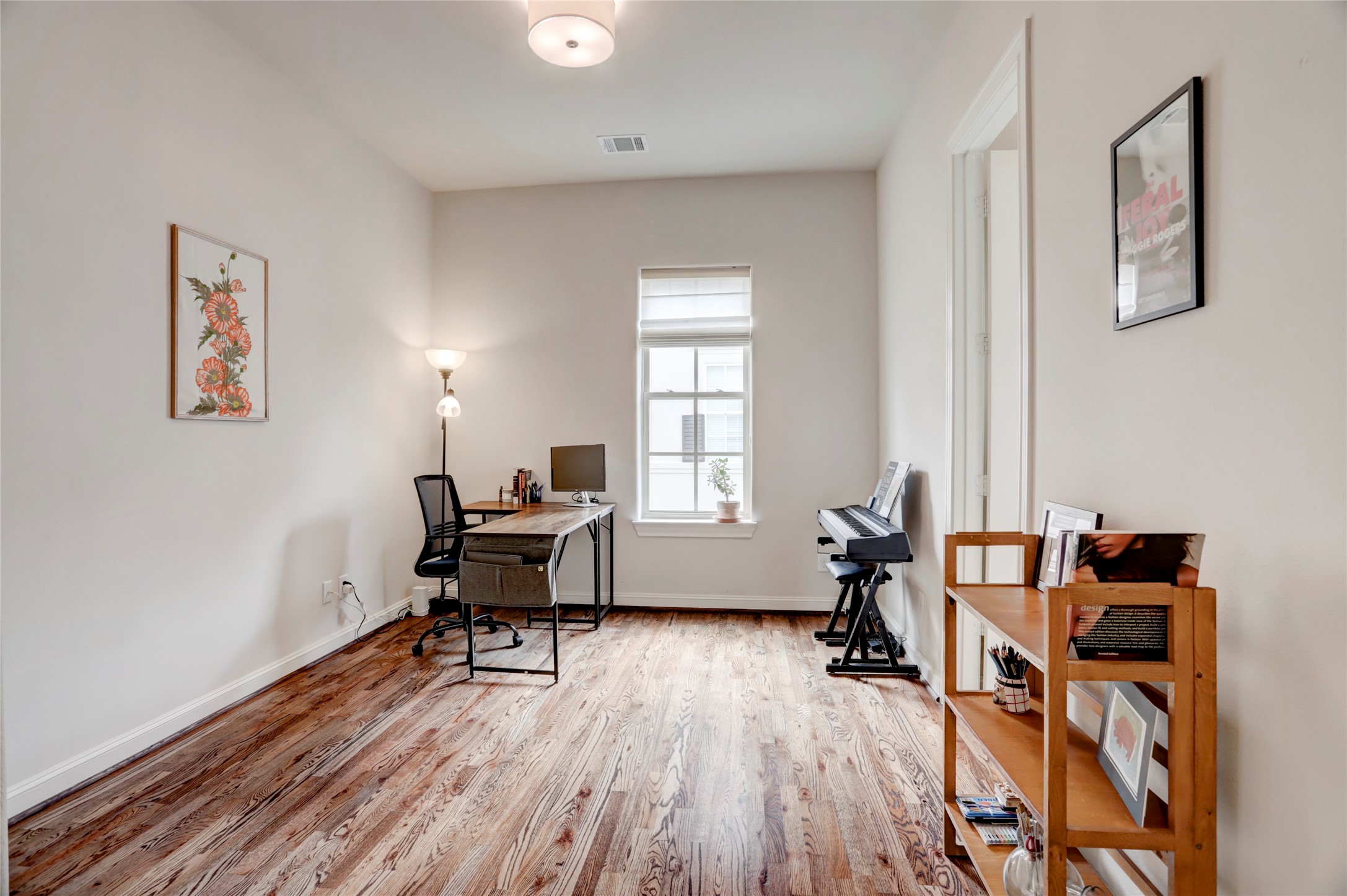 1348 West 25th Street Houston, TX 77008 - Photo 27 of 34 a work room with furniture and wooden floor