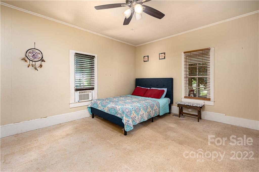 1212 Tot Dellinger Road Cherryville, NC 28021 - Photo 12 of 46 a bed sitting in a bedroom next to a window