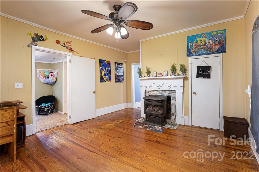 1212 Tot Dellinger Road Cherryville, NC 28021 - Photo 14 of 46 a living room with furniture and a fireplace